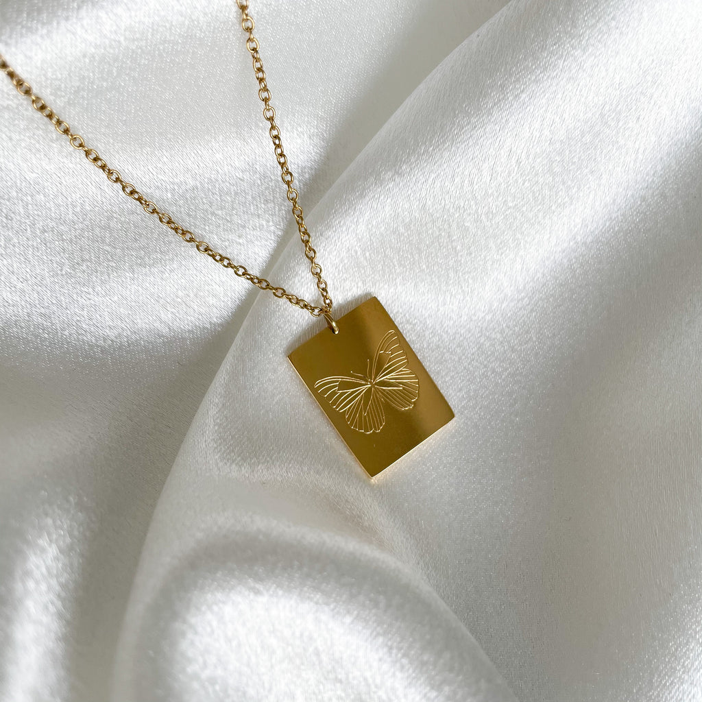 This 'Mariposa' pendant is engraved with a hand drawn butterfly by our artist in Peru. The pendant symbolizes the strength to grow, evolve, and transform. Spreading those wings to be free and trusting the magic of new beginnings.  Necklace Available in 14K Gold Vermeil or Silver  and adjustable chain.